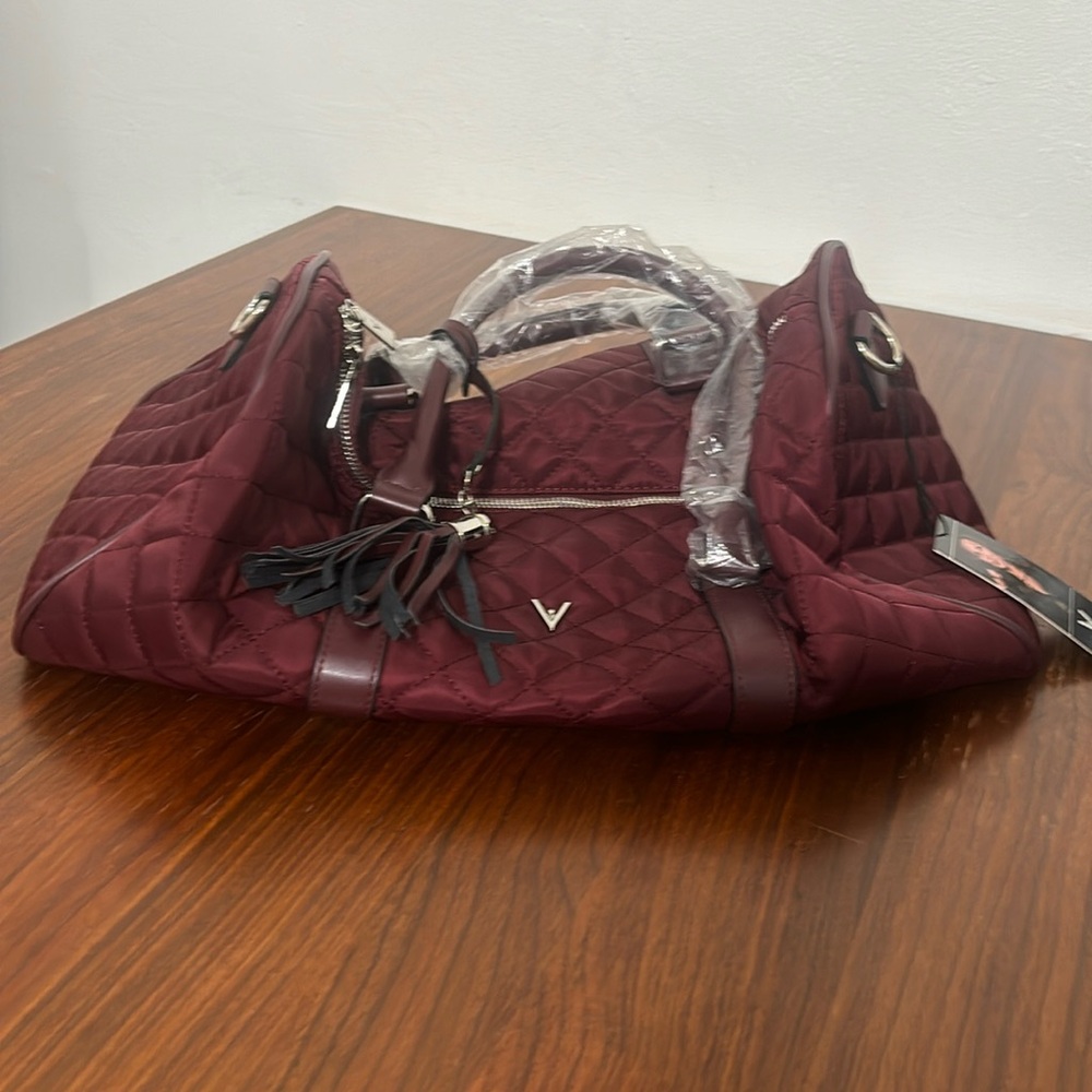 New Vanessa Williams Duffel Bag. Burgundy with additional strap. New with tags.